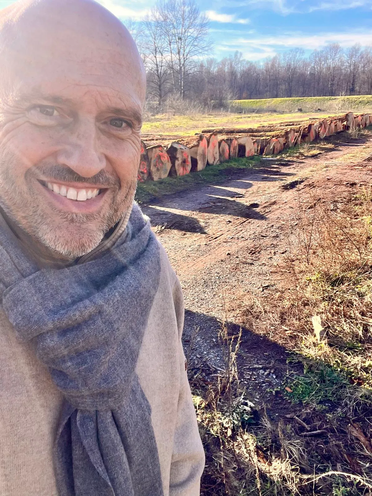 Portrait at a log yard on a sunny winter day