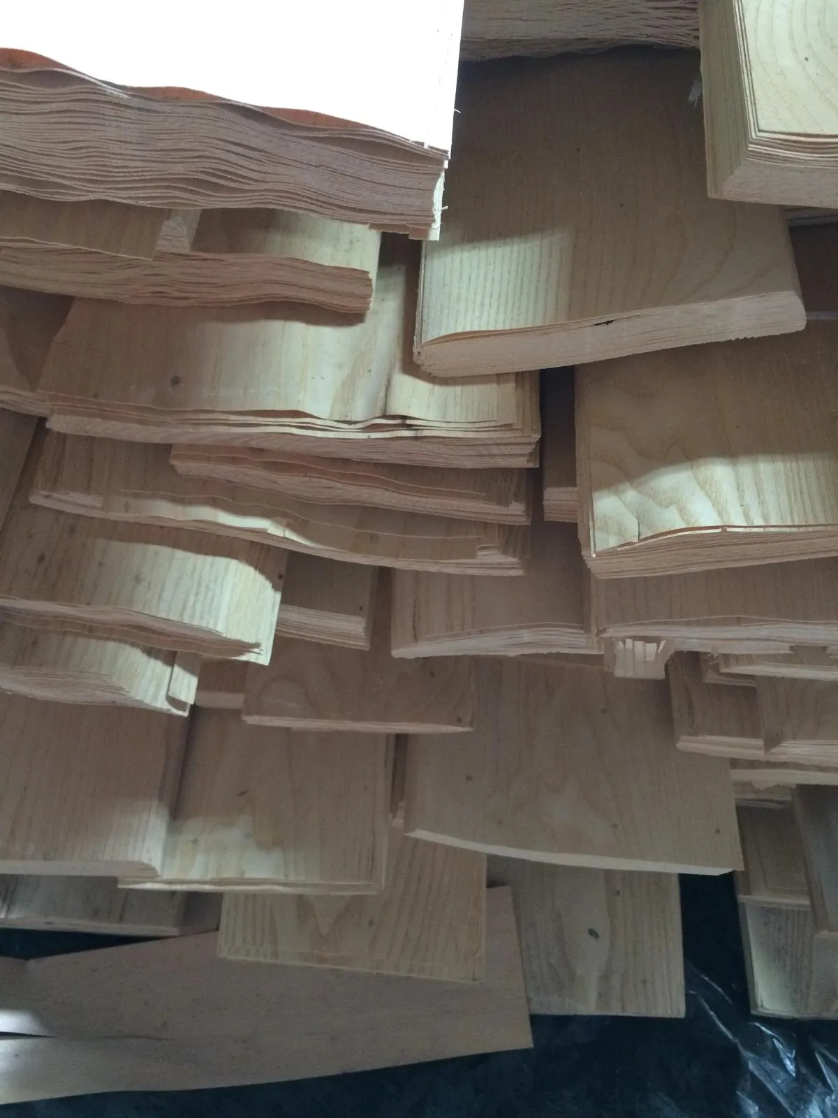 Stacked sawn boards with natural edges