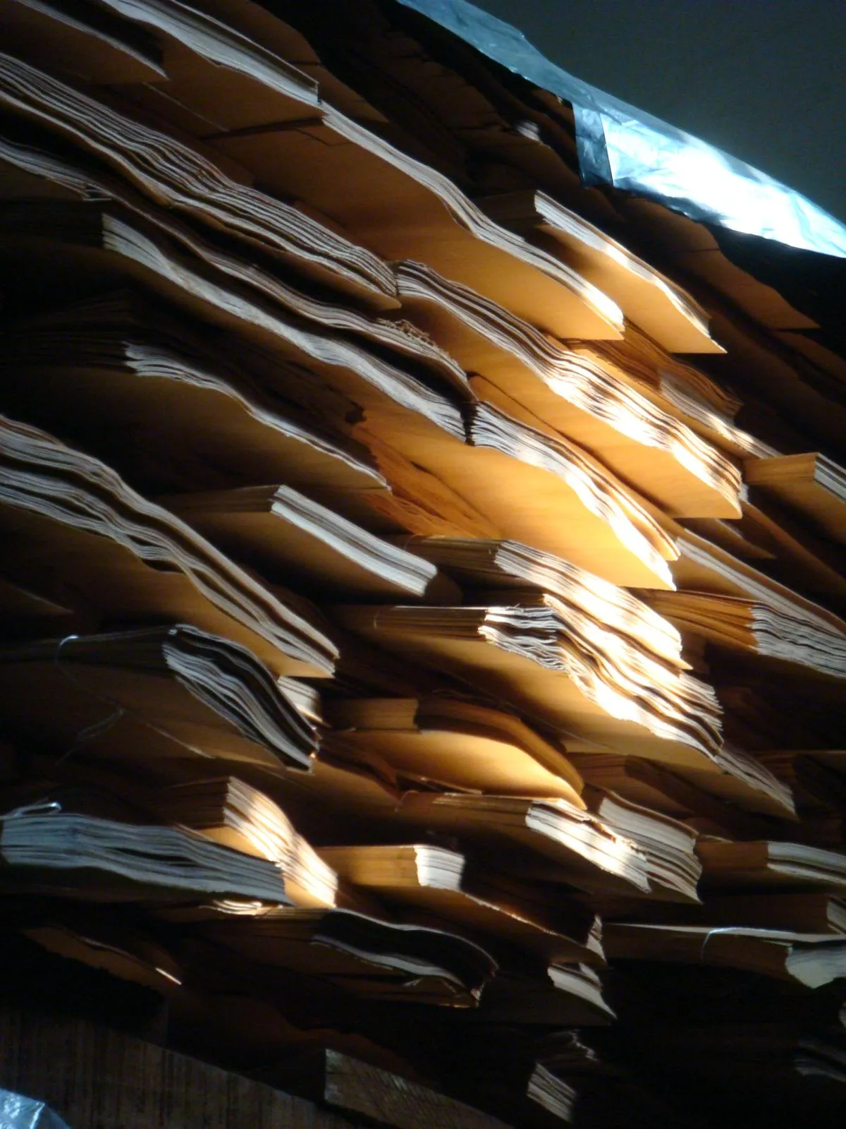 Stacked veneer bundles in a warehouse