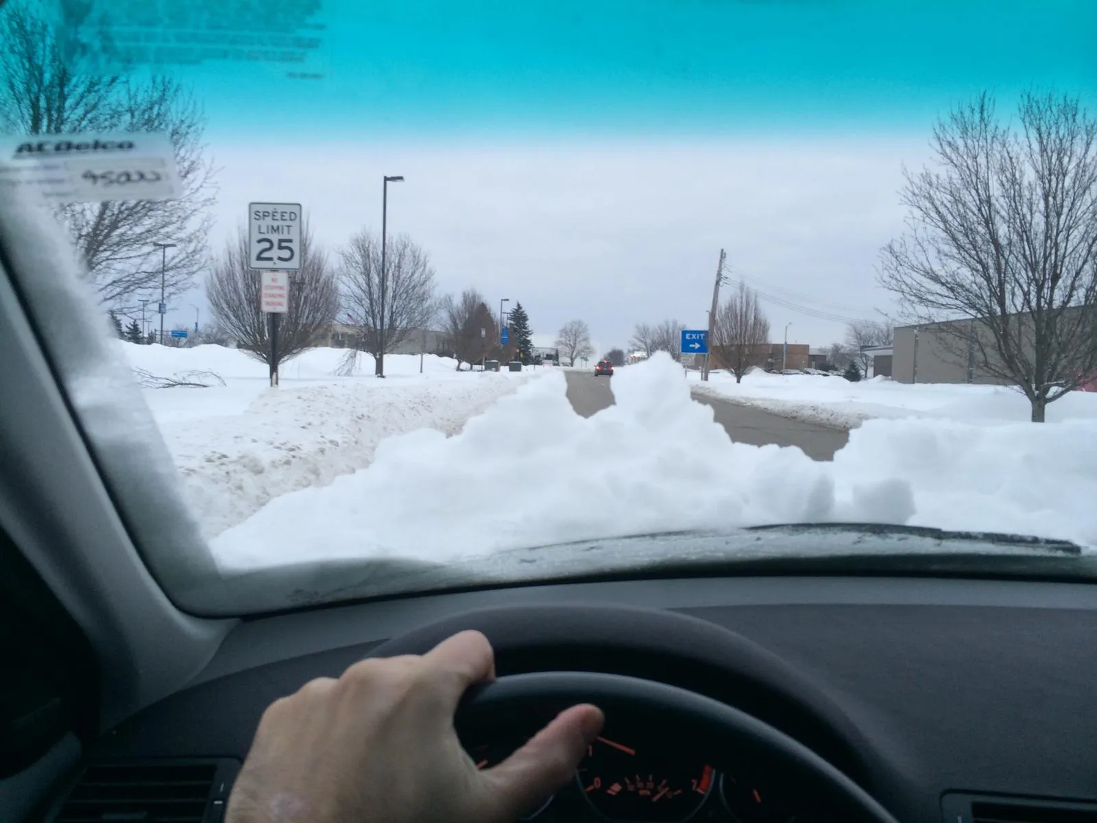 Driving along a snow-covered road in winter